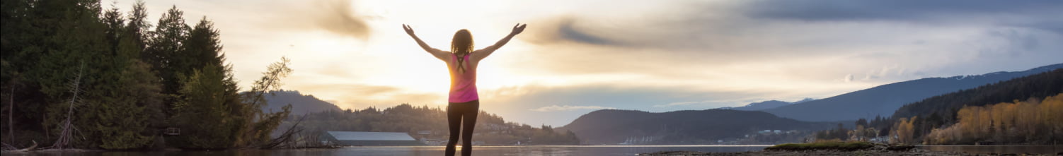 woman celebrating with her hands in the air