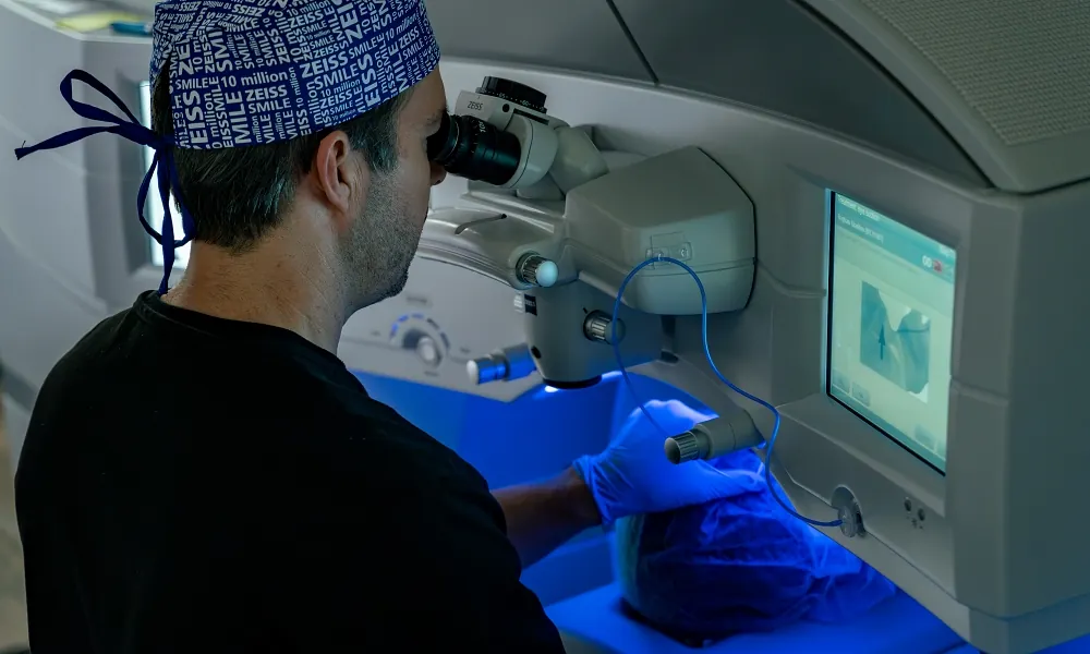 Dr. Taylor Strange at the laser console, treatment display visible during Briggs's LASIK procedure